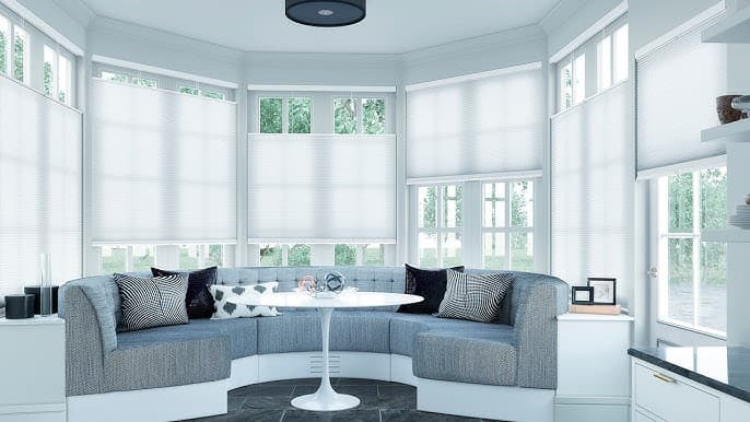 Motorized Roller Shades - Window Coverings by Deluxe in Calgary Residence. Custom automated roller shades with clean lines and precision light filtration, tailored for modern floor-to-ceiling windows.