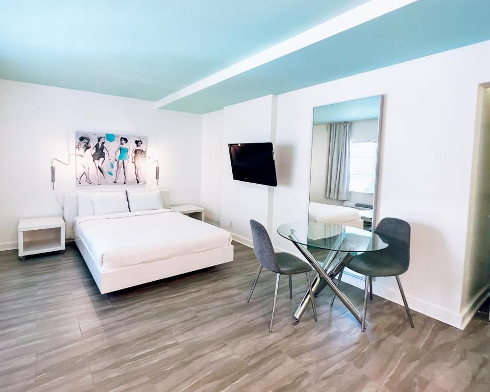 Modern multi-tonal commercial resilient wood-grain plank flooring in an executive suite