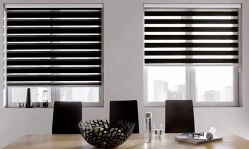 Blackout Bedroom Roller Blinds - Window Coverings by Deluxe in Calgary Residence. Total blackout roller shades engineered with precision side channels for complete room darkening and superior sleep comfort.