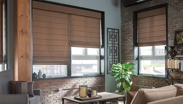 Tailored Roman Shades - Window Coverings by Deluxe in Calgary Residence. Hand-finished fabric Roman shades with elegant horizontal pleats, adding warmth and soft architectural structure to living spaces.