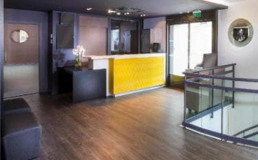 Wide plank commercial engineered flooring in retail gallery space