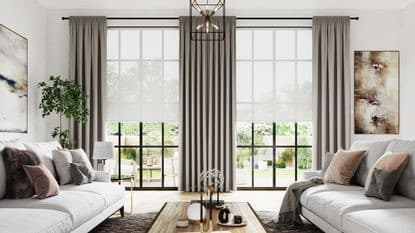 Continuous ripplefold wave drapery framing full-height sliding glass patio doors